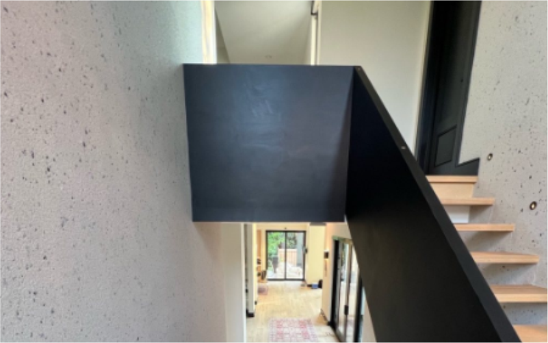 Interior wall stucco and the stairs case wood stain